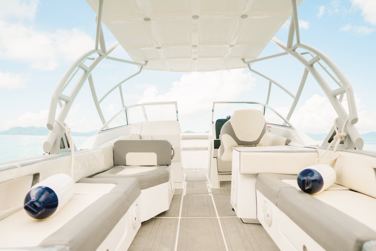Cushioned deck seating and shade canopy aboard Keelooma's private speedboat Kandooma, El Nido island hopping tour