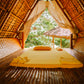 Inside a bamboo and thatch kubo at a Keelooma beach camp, with a bed facing the sea, Palawan