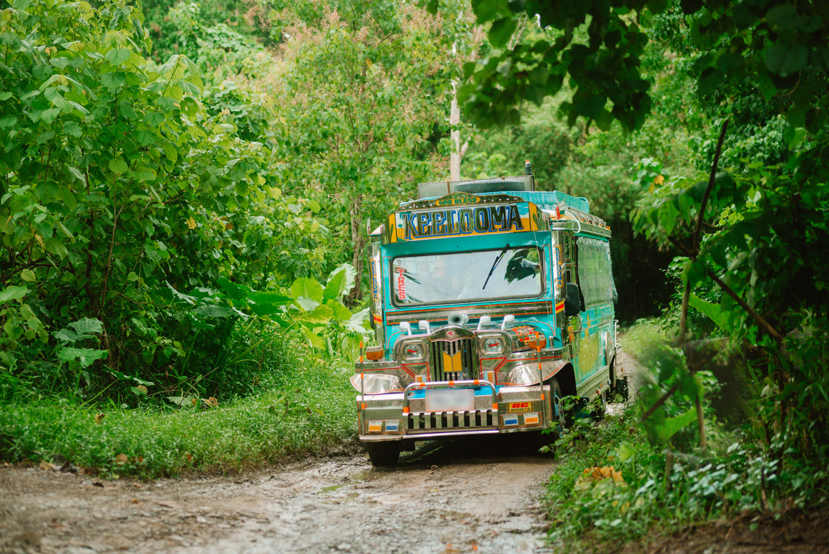 Keelooma's jeepney arriving along a jungle track at Kaseledan Farm in northern El Nido, Palawan
